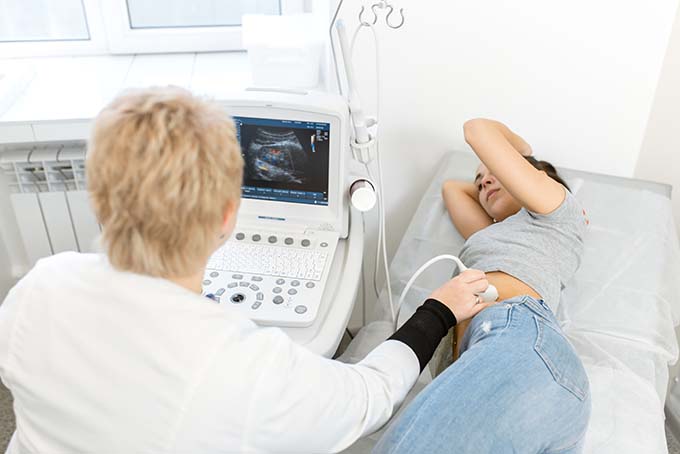 Medical technician performing ultrasound